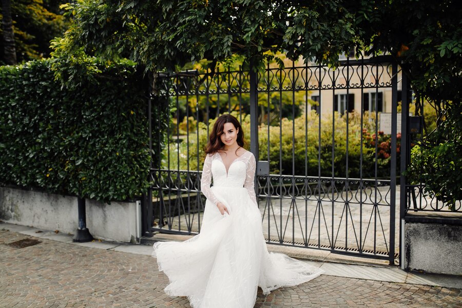 Casual bridal wear featuring a light pastel gown with minimal embroidery, paired with delicate jewelry